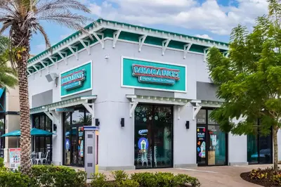 a white building with a walmart sign on it at Caribbean Dreamin - Vibrant Margaritaville Resort in Orlando