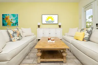 a living room with two couches and a coffee table at Coconut Cabana - Access 4 Most in Orlando