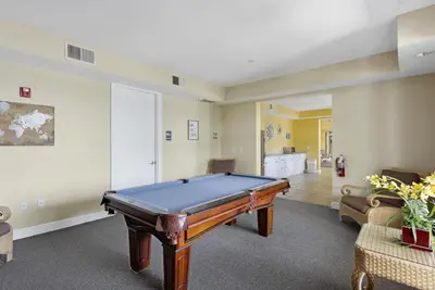 a living room with a pool table in it at Family Friendly Relax Villa in Kissimmee