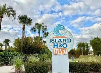 a sign for a island live sign at Flamingo Paradise in Orlando
