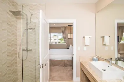 a bathroom with a sink and a shower at Villa at Magic Village Resort with Outdoor Oasis in Orlando