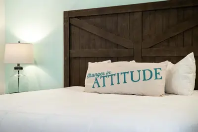 a bed with a white pillow with the words anticipate at Frankly Fintastic - Happy Days in Orlando