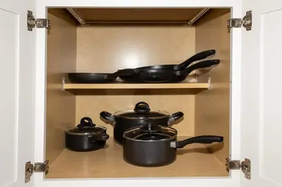 a group of pots and pans on a shelf at Up to Scale With Margaritas in Orlando