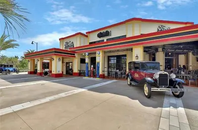 an old car parked in front of a store at Turquoise Breeze - Close to Disney in Orlando