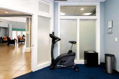 a gym with a exercise bike in a room at Tranquil Breeze at Caribe Cove in Orlando
