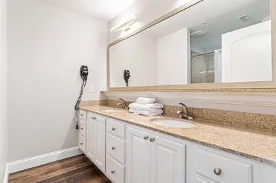 a bathroom with a sink and a mirror at Lake Views At Blue Heron in Orlando