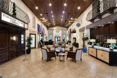 a lobby with chairs and tables in a store at Main Street Gem in Paradise Palms Resort in Kissimmee