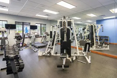 a gym with several tread machines and treadles at Main Street Gem in Paradise Palms Resort in Kissimmee