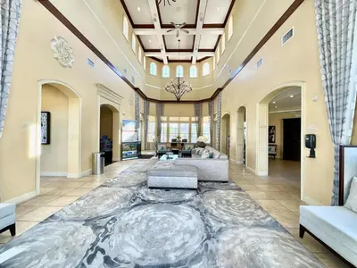 a large living room with a large marble floor at Minutes to Magic in Orlando