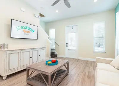 a living room with a couch and a table at Parrotfish Place - Stay for 6 in Orlando