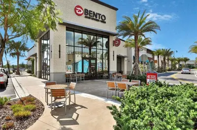 a berkoco store with chairs and tables in front of it at Parrotfish Place - Stay for 6 in Orlando