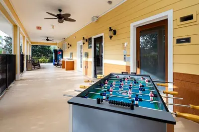 a pool table on the side of a house at Peaceful Horizons at Caribe Cove in Kissimmee