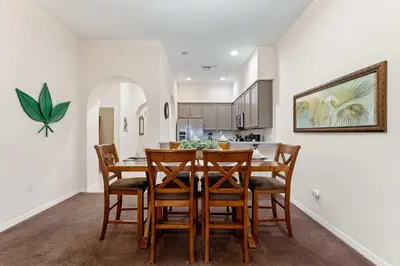 a kitchen and dining room with a table and chairs at Peaceful Horizons at Caribe Cove in Kissimmee