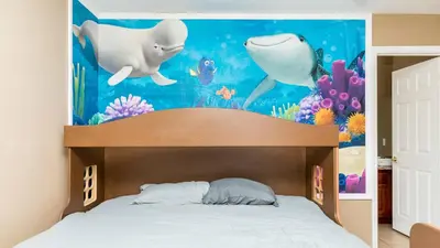 a bedroom with a shark mural above a bed at Serendipity at Acadia - Family getaway in Orlando