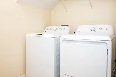 two washers and a dryer in a room at Serendipity at Acadia - Family getaway in Orlando