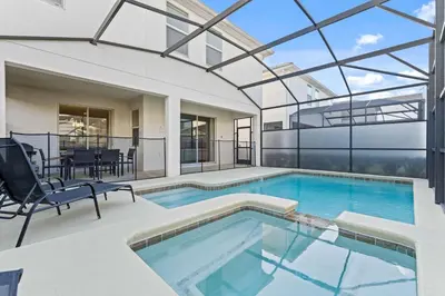 an indoor swimming pool with a glass ceiling at Sun & Fun Storey Lake in Kissimmee