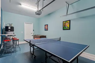 a ping pong room with a ping pong table in it at Sun & Fun Storey Lake in Kissimmee