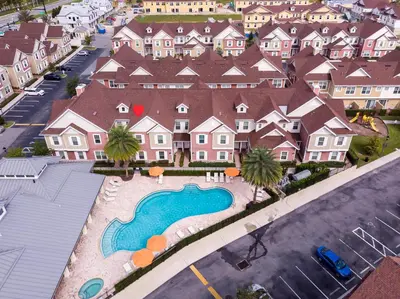 an aerial view of a large house with a swimming pool at Sunrise in Kissimmee - Near Disney World in Orlando