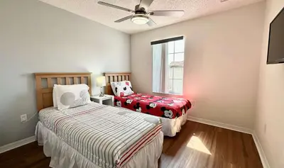 a bedroom with two beds and a window at Terra Verde - Resort Amenities & More in Kissimmee