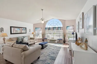 a living room with a couch and a table at 2466 Sweetwater in Kissimmee