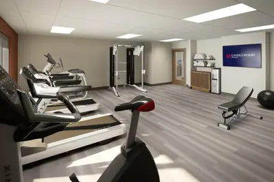 a gym with several cardio machines in a room at Candlewood Suites Orlando North - Winter Park by IHG in Orlando