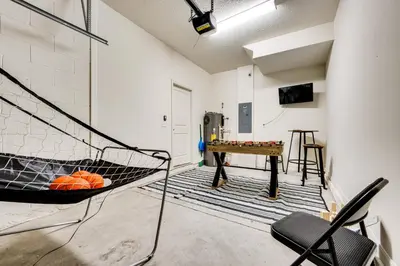 a room with a ping pong table and a ping pong ball at 4 Mi to WDW Sleek Townhome with Community Pool! in Kissimmee