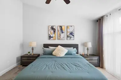 a bedroom with a blue bed with two night stands at Enjoy your Summer Near to Disney- Universal-Epic in Kissimmee