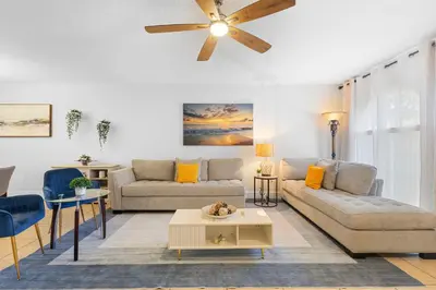 a living room with a couch and a ceiling fan at Enjoy your Summer Near to Disney- Universal-Epic in Kissimmee