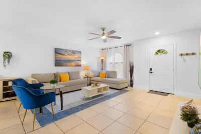 a living room with a couch and a table at Enjoy your Summer Near to Disney- Universal-Epic in Kissimmee
