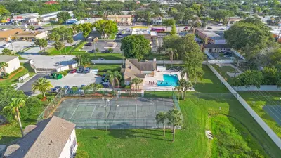 an aerial view of a tennis court in a residential neighborhood at Enjoy your Summer Near to Disney- Universal-Epic in Kissimmee