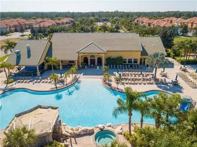 an aerial view of a pool at a resort at Fully Equipped Comfortable Townhouse in Kissimmee