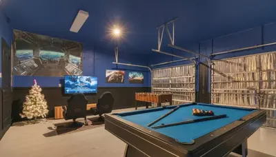 a library with a pool table and a christmas tree at Disney Retreat w/ Wizard & Galaxy Rooms in Orlando
