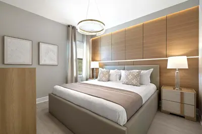 a bedroom with a large bed and a lamp at Magical 15-Bedroom Villa | Game Room, Theater & More! in Kissimmee