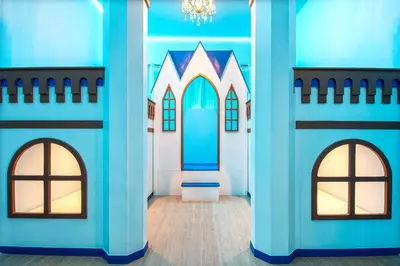 a room with a castle themed room with two windows at Themed Kids' Rooms, Pool & Game Loft Near Disney in Kissimmee