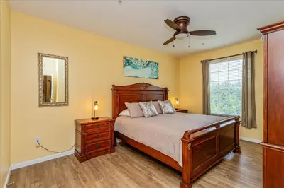 a bedroom with a bed and a ceiling fan at Peaceful Getaway in Windsor Hills in Orlando