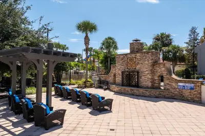 a row of chairs in front of a building at Cozy Townhome in Fantasy World Near Parks in Kissimmee