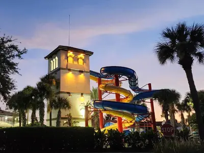 a water slide in front of a building at Family Townhouse with Waterpark - Minutes from Disney in Kissimmee
