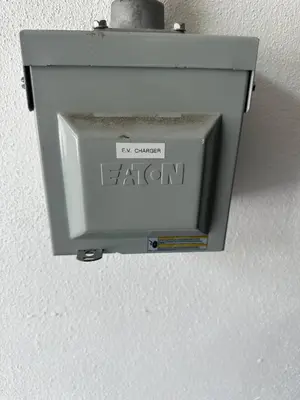 a metal box on a wall with the words eaton at Historic Retreat on Eola + Private Hot Tub + Grill in Orlando