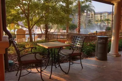 a table and two chairs sitting next to a table at Wyndham Bonnet Creek 3BR Apartment with Resort Access in Orlando