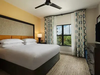 a bedroom with a large white bed and a window at Sheraton Vistana Villages 2BR Apartment with Resort Access in Orlando