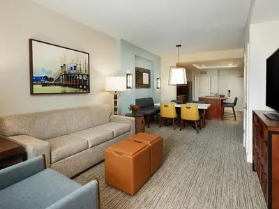 a living room with a couch and a dining room at Sheraton Vistana Villages 2BR Apartment with Resort Access in Orlando
