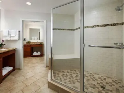 a bathroom with a shower with a glass door at Sheraton Vistana Villages 3BR Apartment with Resort Access in Orlando