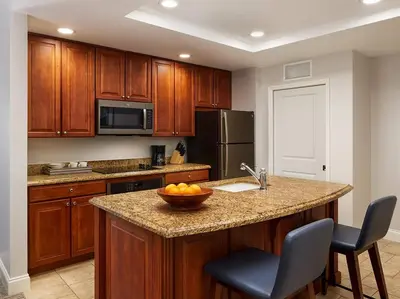 a kitchen with a bowl of fruit on a counter at Sheraton Vistana Villages 3BR Apartment with Resort Access in Orlando