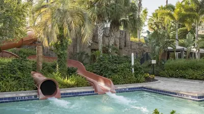 a slide in a pool at a resort at Marriott's Lakeshore Reserve Studio Apartment with Resort Access in Orlando