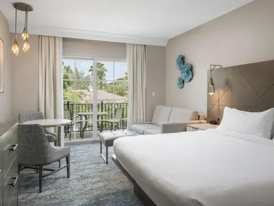 a hotel room with a bed and a balcony at Marriott's Lakeshore Reserve Studio Apartment with Resort Access in Orlando