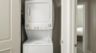 a white washer and dryer in a room at Marriott's Lakeshore Reserve 1BR Apartment with Resort Access in Orlando