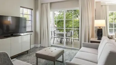 a living room with a couch and a television at Marriott's Lakeshore Reserve 3BR Apartment with Resort Access in Orlando