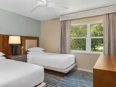 a hotel room with two beds and a window at Sheraton Vistana Resort Two Bedroom Apartment with Resort Access in Orlando