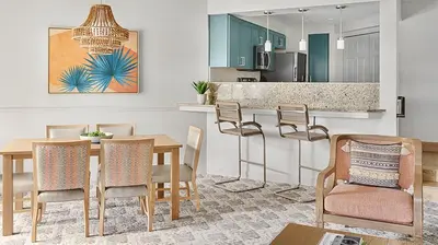 a kitchen and dining room with a table and chairs at Marriott's Sabal Palms 2BR Apartment with Resort Access in Orlando