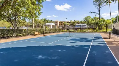 a tennis court with a tennis racket on it at Marriott's Sabal Palms 2BR Apartment with Resort Access in Orlando